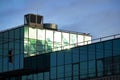 Modern glass building with sky reflection in windows Royalty Free Stock Photo