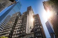 Modern glass and classic tall office buildings in New York. A perspective view from below