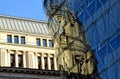 Modern glass curtain wall building facade with strong reflections. classic old building mirrored in the glass