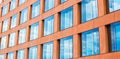Modern glass facade of an office building, reflection of the sky in the Windows Royalty Free Stock Photo