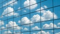 Modern glass facade reflecting blue sky and clouds close-up, architectural background Royalty Free Stock Photo