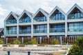 Modern glass fronted apartment homes on the sea front in Whitstable, Kent, UK