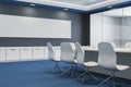 Modern glass meeting or conference room interior with furniture, blue carpet and clean wide black mock up banner on wall. 3D Royalty Free Stock Photo