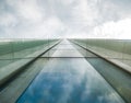 Modern glass office building agaist the cloudy sky Royalty Free Stock Photo