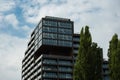 Modern glass office building exterior with glass facade on clear sky background. Transparent glass wall of office Royalty Free Stock Photo