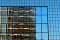 Modern Glass Office Building with Reflection of Pattern and Lines Blue Hour Light Royalty Free Stock Photo