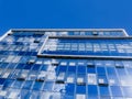 Modern glass office business building - clouds reflections Royalty Free Stock Photo