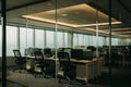 Modern glass partition with workstations flooded with natural and recessed lighting for a serene workspace Royalty Free Stock Photo