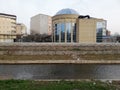 Modern round building with interesting architecture on sunny day. Royalty Free Stock Photo