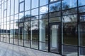 Modern glass windows office building architecture facade building outside urban view walking space in city Royalty Free Stock Photo