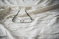 Modern Glasses on white bed Royalty Free Stock Photo