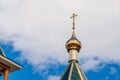 modern Golden dome with a cross on the green roof of the Orthodox Christian Church Royalty Free Stock Photo