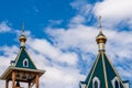 Modern Golden dome with a cross on the green roof of the Orthodox Christian Church Royalty Free Stock Photo