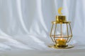 Modern golden lantern that have moon symbol on top with white background