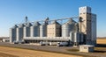 Grain Storage Facility with Trucks and Silos Royalty Free Stock Photo