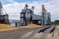 Modern Granary elevator. Silver silos on agro-processing and manufacturing plant for processing drying cleaning and storage of