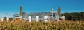 Modern Granary, Grain-drying Complex, Commercial Grain Or Seed Silos In Sunny Summer Rural Landscape. Royalty Free Stock Photo