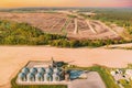 Modern Granary, Grain-drying Complex, Commercial Grain Or Seed Silos In Sunny Spring Rural Landscape. Corn Dryer Silos Royalty Free Stock Photo