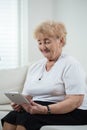 Modern grandma using tablet