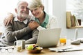 Modern grandparents chatting with their granddaughter Royalty Free Stock Photo