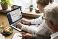 Modern grandparents chatting with their granddaughter Royalty Free Stock Photo