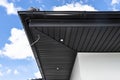 A modern graphite herringbone roof lining is attached to the trusses, visible turned on LED lights.