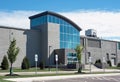 Modern Gray Building with Glass Concave Entrance