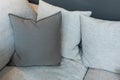 Modern gray fabric pillows on gray cloth sofa interior in living room decoration design building Royalty Free Stock Photo