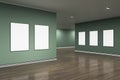 Modern gray gallery interior with blank mock up banners on wall and reflections on wooden flooring. Art, no people, museum and