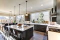 Modern gray kitchen features dark gray flat front cabinets