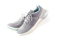 Modern gray-light green sneakers for men or women (unisex) isolated on a white background. Royalty Free Stock Photo