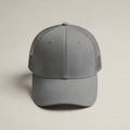 Modern gray mesh baseball cap on light background Royalty Free Stock Photo