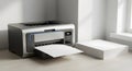 Modern Office Printer Outputting Paper with Stack of Blank Sheets Royalty Free Stock Photo
