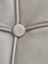 Modern gray tufted leather headboard with button details Royalty Free Stock Photo