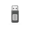 Modern gray USB flash drive with rounded edges and horizontal lines on its casing, representing data storage and Royalty Free Stock Photo