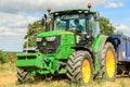 A modern green john deere 6190r tractor