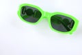 Modern green sunglasses isolate on a white  background.Traveler and summer accessories Royalty Free Stock Photo