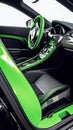 Modern green supercar interior with the leather panel, sport seats, multimedia, and digital dashboard. View from the