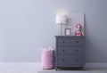 Modern grey chest of drawers near wall in child room, space for text. Interior design Royalty Free Stock Photo