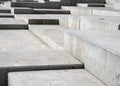 Close up modern grey concrete angular steps in geometric angular shapes on multiple levels