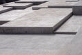 Large modern grey concrete angular steps in geometric angular shapes on multiple levels