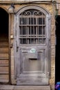 Modern grey metal door openwork with peaks a beautiful vintage background Royalty Free Stock Photo