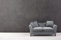 Modern grey sofa on grey wall background. Free space Royalty Free Stock Photo
