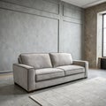 Modern grey sofa on grey wall background Royalty Free Stock Photo