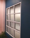 Modern Grid Window on Blue Interior Wall Royalty Free Stock Photo