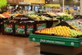 A modern grocery store produce section