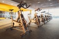 Modern gym interior with equipment, fitness exercise bikes Royalty Free Stock Photo