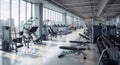 Modern gym interior with natural light and extensive equipment Royalty Free Stock Photo