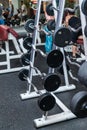 Modern Gym Room Fitness Center With Equipment And Machines. Interior of gym fitness room with large windows and treadmills Royalty Free Stock Photo