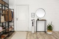 Modern hallway interior with mirror and storage unit Royalty Free Stock Photo